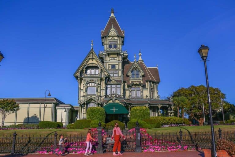 Historical Victorian mansion in Eureka California with historic architecture and garden, popular among tourists.