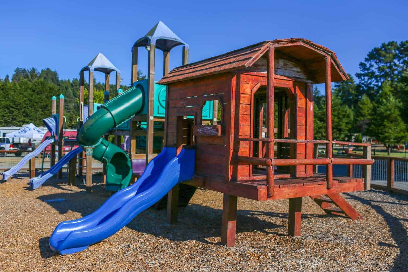 Colorful playground structure with slides at California Nomad, outdoor fun for families and kids.