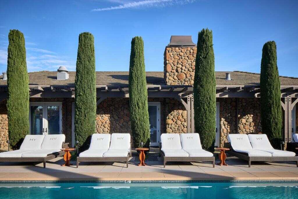 Luxurious California Nomad poolside lounge area with serene environment and scenic surroundings.
