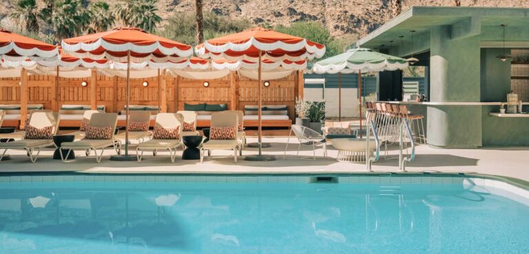 Poolside lounge area at Palm Springs California in with umbrellas and modern décor.